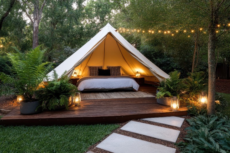 vecteezy_a-tent-with-a-bed-and-lights-on_60206308