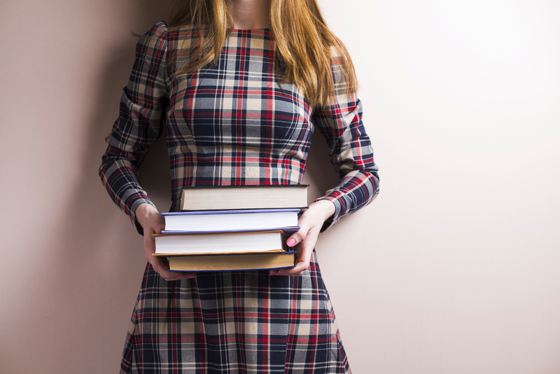 young-woman-with-four-heavy-books-2