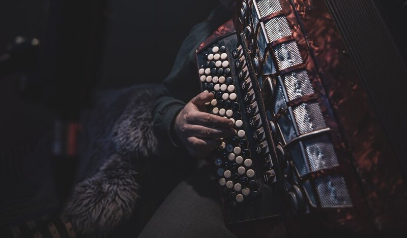 musician-plays-button-accordion-